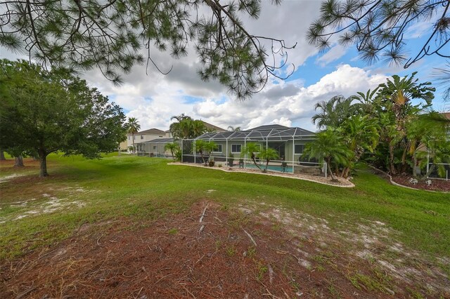 view of yard featuring glass enclosure