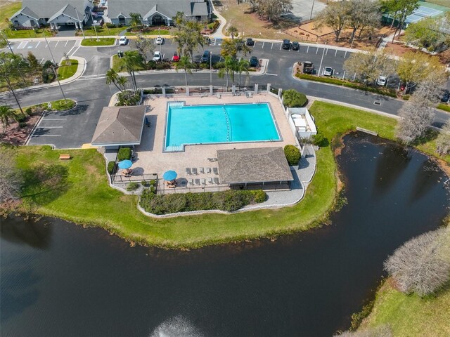 birds eye view of property with a water view