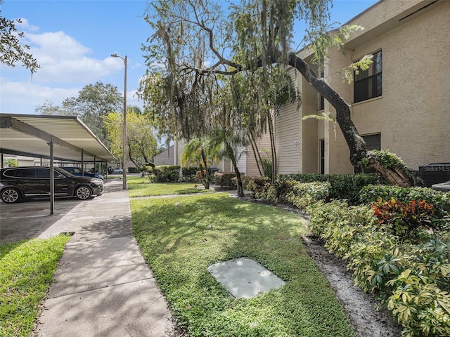 view of yard with a carport