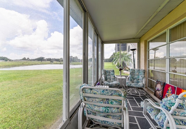 sunroom with a water view