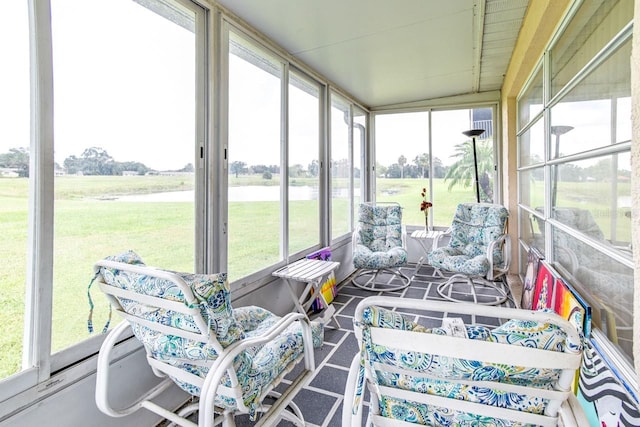 sunroom featuring lofted ceiling and a wealth of natural light