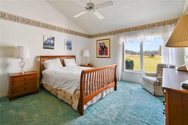 carpeted bedroom with ceiling fan, lofted ceiling, and a textured ceiling