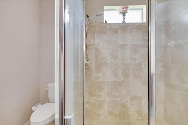 bathroom with walk in shower and toilet