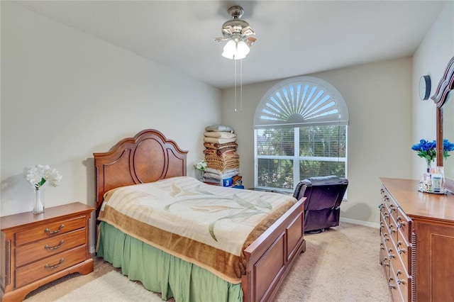 bedroom featuring ceiling fan and light colored carpet