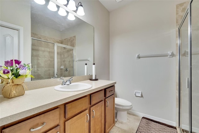 bathroom with tile patterned floors, a shower with shower door, vanity, and toilet