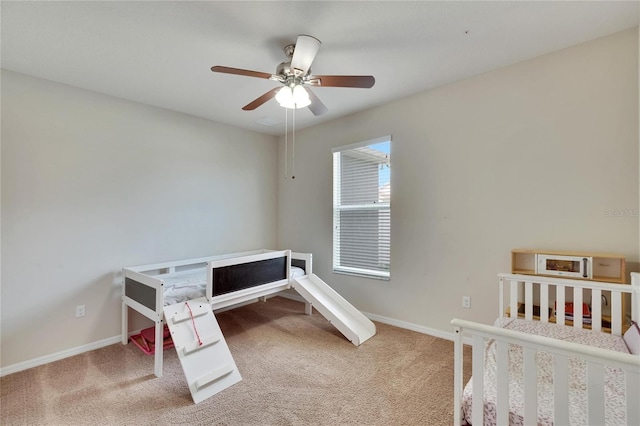 carpeted bedroom featuring ceiling fan