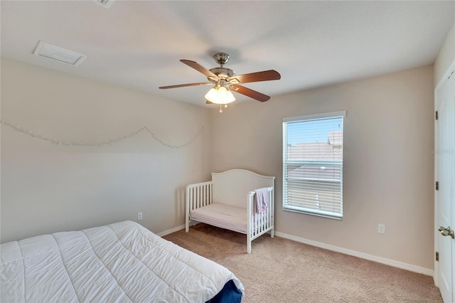 carpeted bedroom with ceiling fan