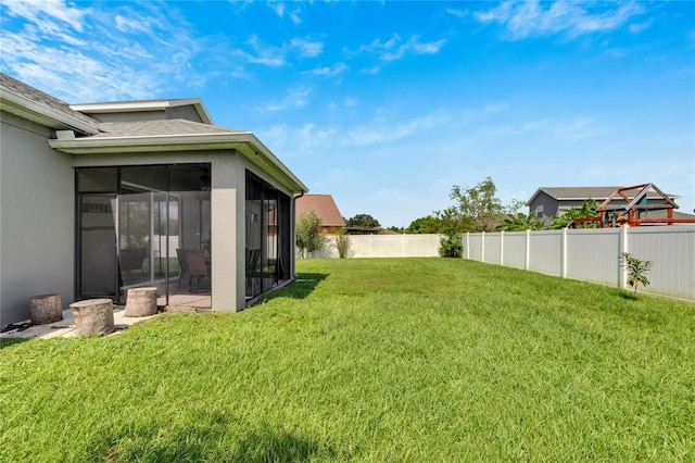 view of yard with a sunroom