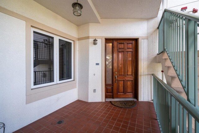 1030 Bellasol Way Unit 201, Apollo Beach, FL 33572 - entrance to property featuring stucco siding and a balcony