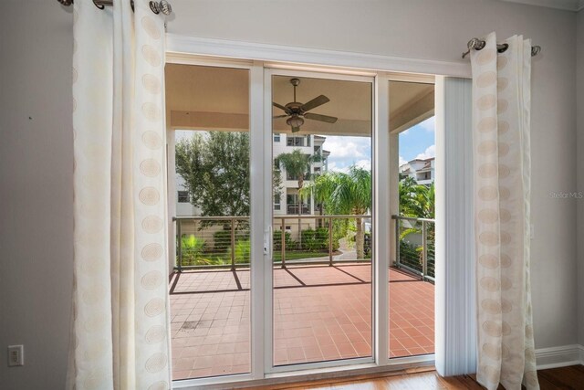 1030 Bellasol Way Unit 201, Apollo Beach, FL 33572 - doorway to outside with a ceiling fan, plenty of natural light, and wood finished floors