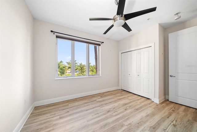 unfurnished bedroom featuring a closet, ceiling fan, and light hardwood / wood-style floors