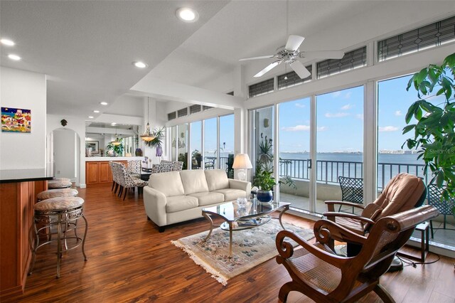 5153 Isla Key Blvd S Unit 412, Saint Petersburg, FL 33715 - living room with dark wood-style flooring, a water view, ceiling fan, and recessed lighting