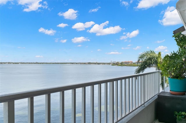 balcony featuring a water view