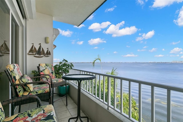 balcony featuring a water view