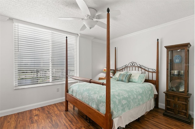 bedroom with ornamental molding, ceiling fan, dark hardwood / wood-style floors, and a textured ceiling