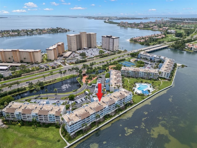 birds eye view of property with a water view