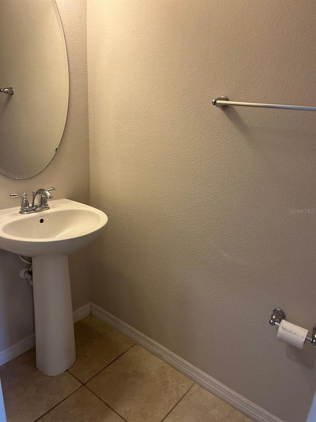 bathroom featuring sink and tile patterned flooring