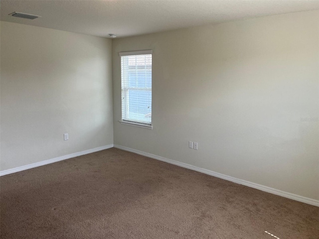 empty room featuring carpet floors