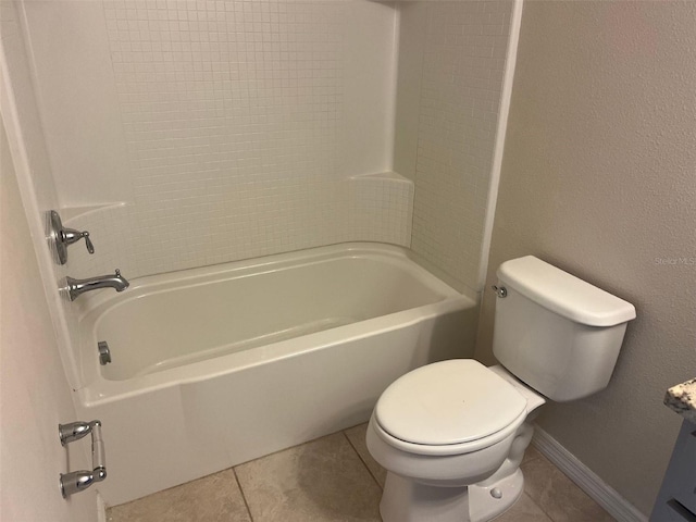 bathroom featuring bathtub / shower combination, toilet, and tile patterned floors