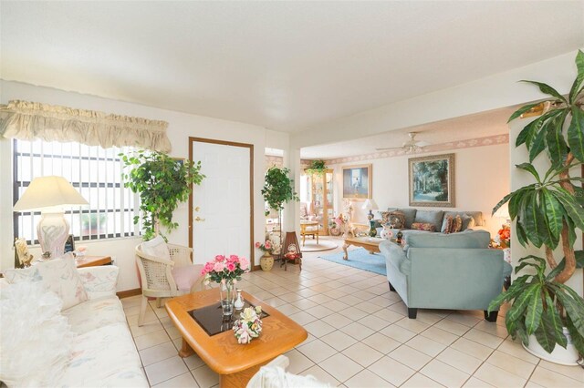 tiled living room with ceiling fan