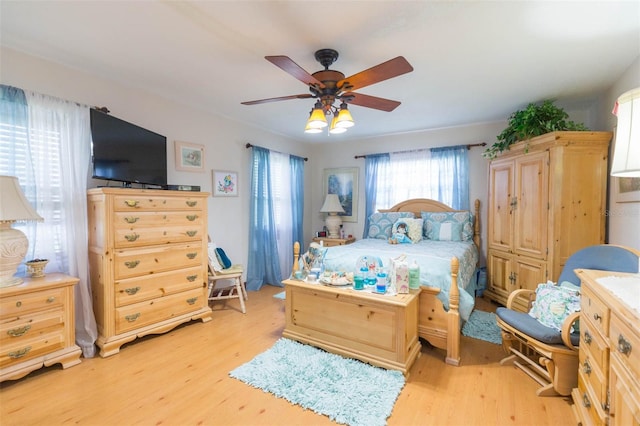 bedroom featuring light hardwood / wood-style flooring and ceiling fan