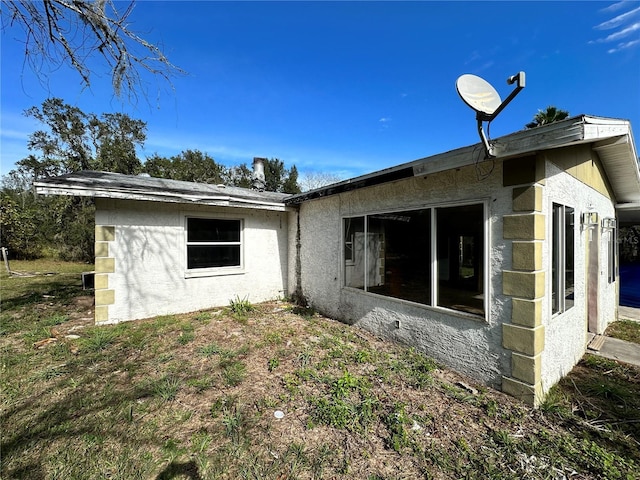 17025 Dalberg Dr, Spring Hill, FL 34610 - rear view of property featuring stucco siding