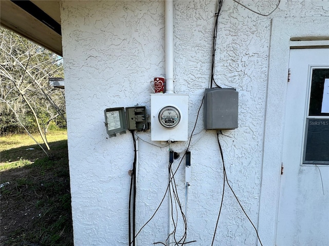 17025 Dalberg Dr, Spring Hill, FL 34610 - exterior view of stucco siding and electric meter
