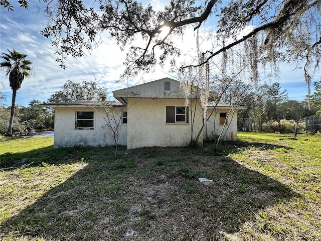 17025 Dalberg Dr, Spring Hill, FL 34610 - back of property featuring stucco siding
