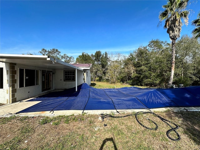 view of pool featuring a patio