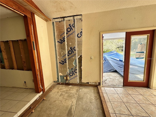 17025 Dalberg Dr, Spring Hill, FL 34610 - entryway with a textured ceiling and a textured wall