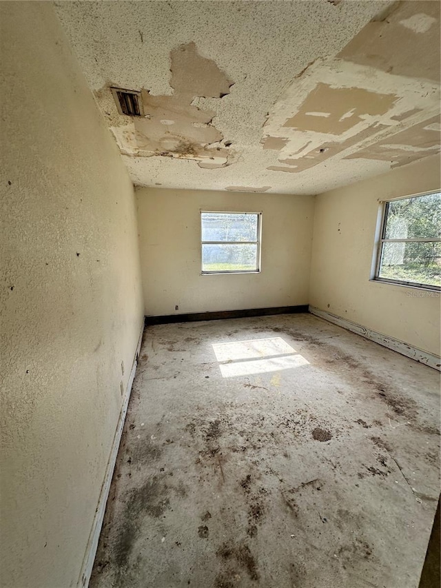 spare room featuring a wealth of natural light