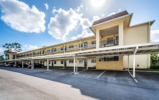 view of vehicle parking featuring a carport