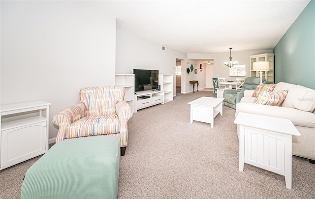 1450 Heather Ridge Blvd Unit 107, Dunedin, FL 34698 - living room featuring a chandelier and carpet floors