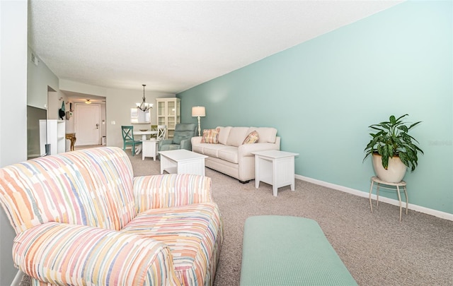 1450 Heather Ridge Blvd Unit 107, Dunedin, FL 34698 - living area with a chandelier, light carpet, and baseboards