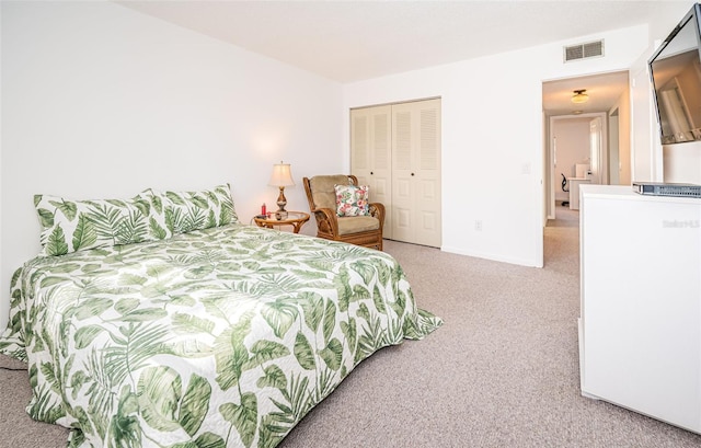 bedroom featuring a closet and carpet flooring