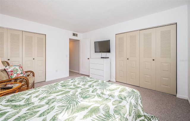 1450 Heather Ridge Blvd Unit 107, Dunedin, FL 34698 - bedroom with light colored carpet and baseboards