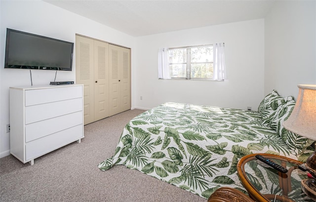 bedroom featuring a closet and light carpet