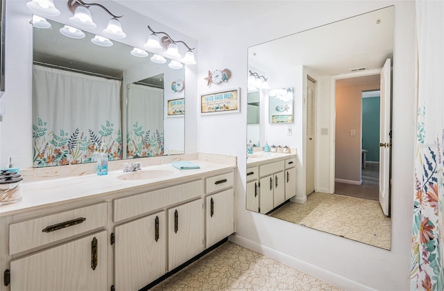 bathroom with vanity and tile patterned floors