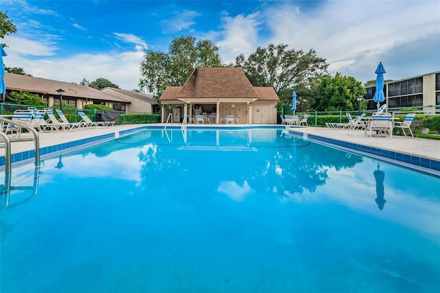 view of swimming pool featuring a patio area