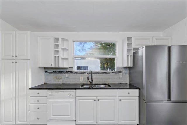 kitchen with stainless steel fridge, sink, white dishwasher, and white cabinets