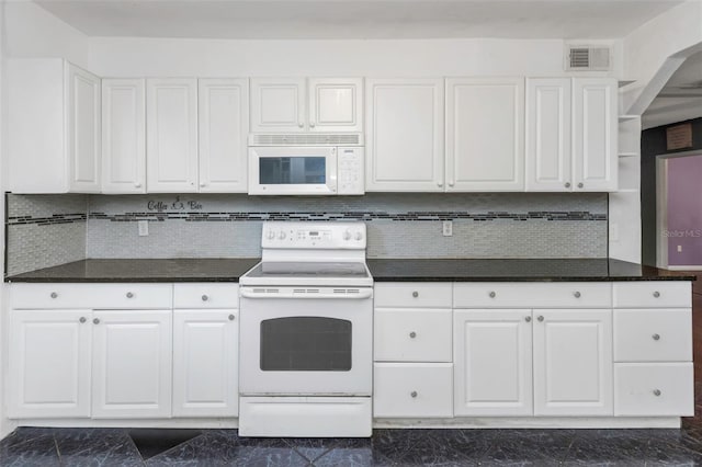 kitchen featuring decorative backsplash, white appliances, and white cabinetry