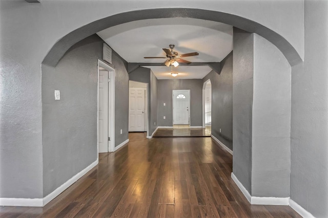 entryway with lofted ceiling with beams, dark hardwood / wood-style floors, and ceiling fan