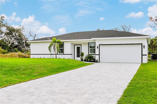 ranch-style house with central AC unit, a front yard, and a garage