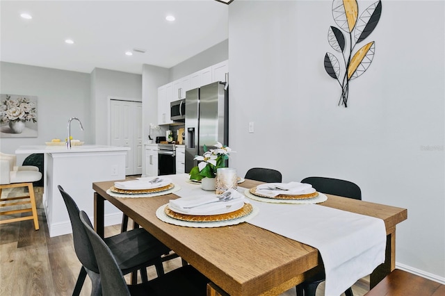 16451 Strauss Ave, Port Charlotte, FL 33954 - dining area with wood finished floors, baseboards, and recessed lighting
