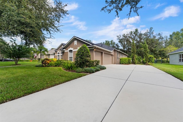 view of front of home featuring a front lawn and a garage