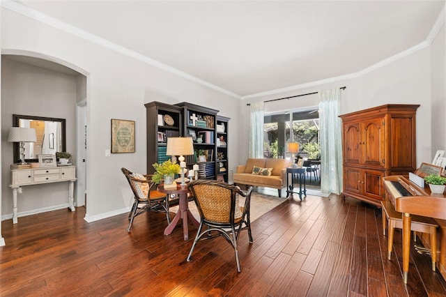 home office with dark hardwood / wood-style floors and crown molding