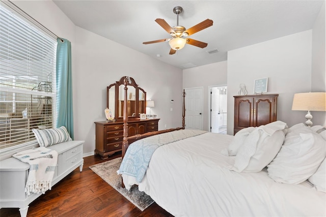 bedroom with ceiling fan and dark hardwood / wood-style flooring