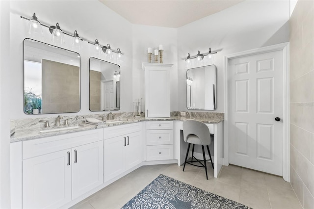 bathroom featuring tile walls, tile patterned floors, and vanity