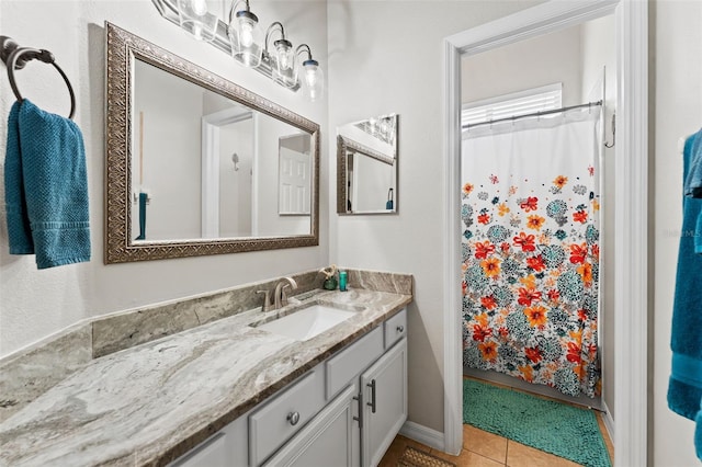 bathroom with vanity and tile patterned flooring