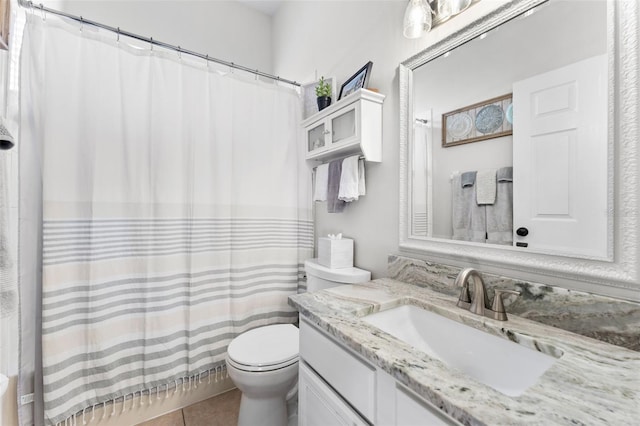 bathroom with tile patterned flooring, a shower with curtain, vanity, and toilet